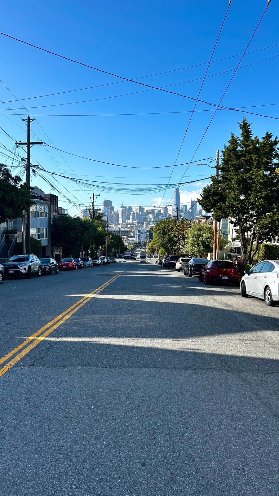 Street running down toward the San Francisco skyline